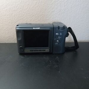VTG Sharp Analog Camcorder Model No VL-E77U.Accessories are missing